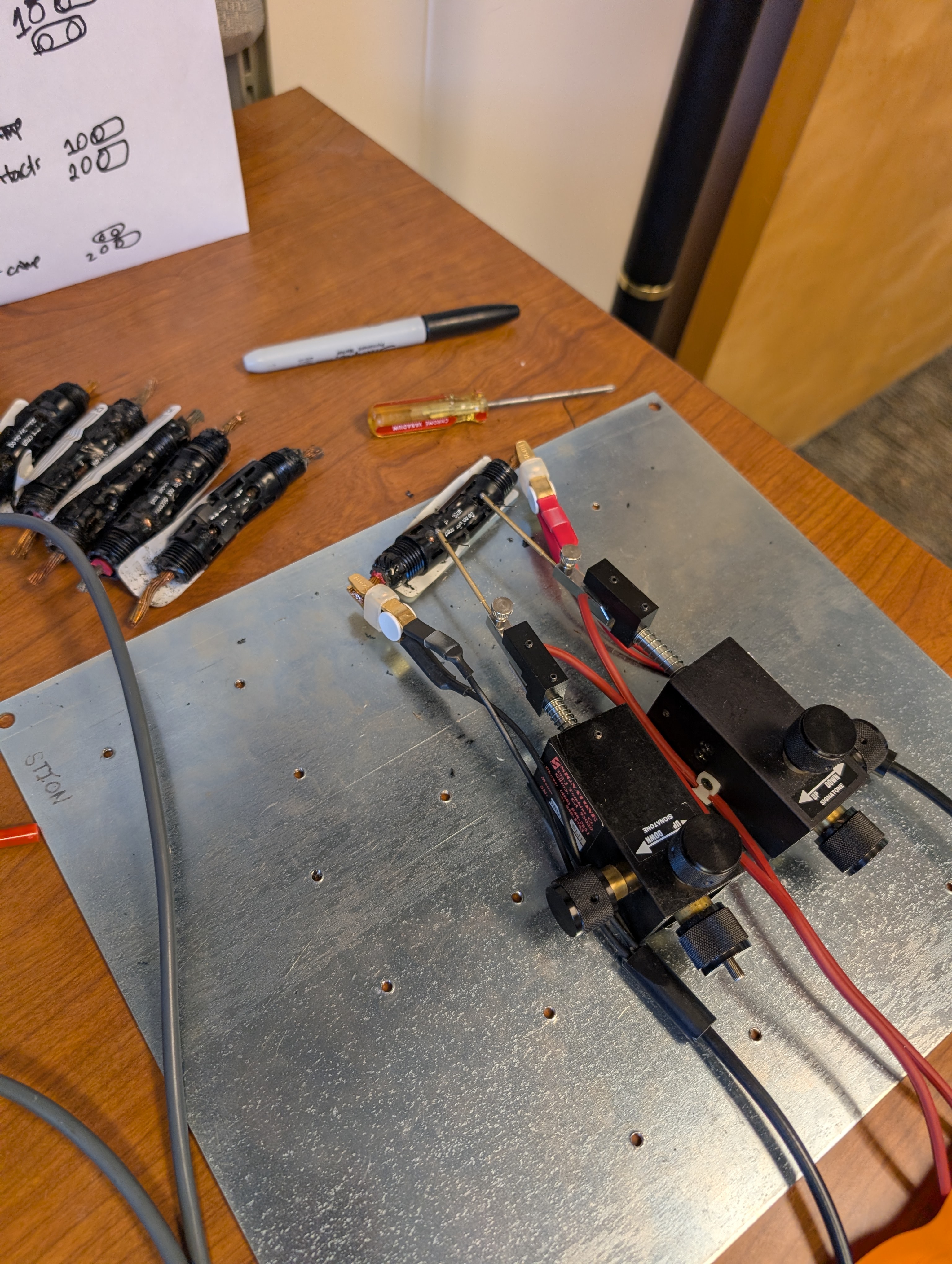 Test bench with PV connectors mounted for evaluation.